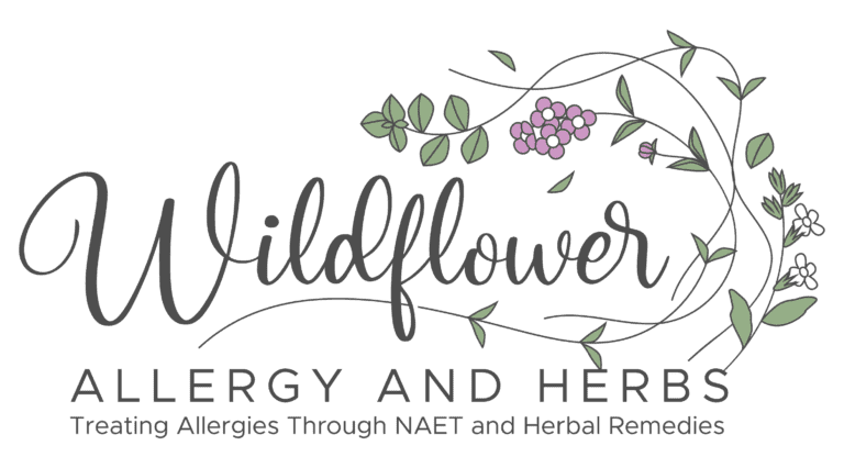 A black and white logo of wildflowers energy and herbs.