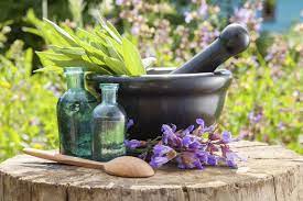 A mortar and pestle with two bottles of medicine.