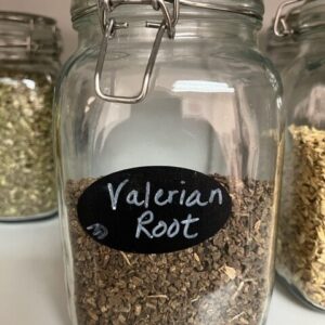 Jar labeled Valerian Root on shelf.
