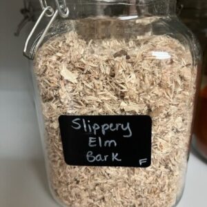Jar labeled "Slippery Elm Bark" on shelf.