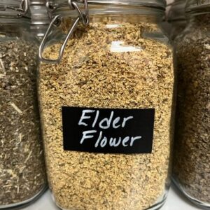 Jar of dried elderflower with label.