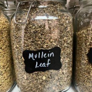 Jar of dried mullein leaf on shelf.