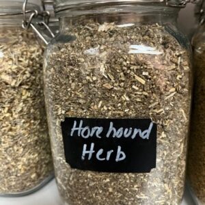 Jar labeled "Horehound Herb" on shelf.