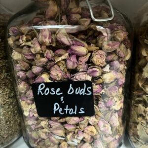 Jar of dried rose buds and petals.