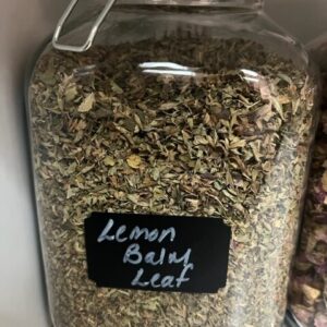 Jar of dried lemon balm leaves.